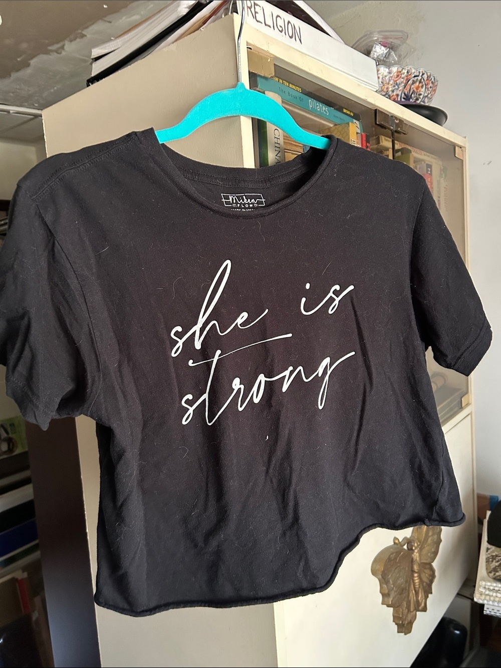 Miken Black Crop Tee with White "she is strong" Script